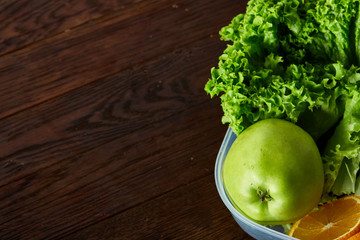 Healthy lunch prepared in small plastic container, top view, close-up.