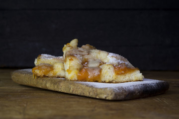 Apricot Cake With Mint Leaves On a Rustic Wooden Board