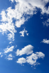 Clouds on a blue sky as a background