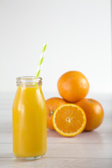 Orange Fruit Smoothy on a White Wood Table