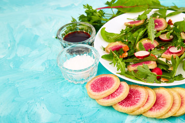 Salad in white plate around Ingredient