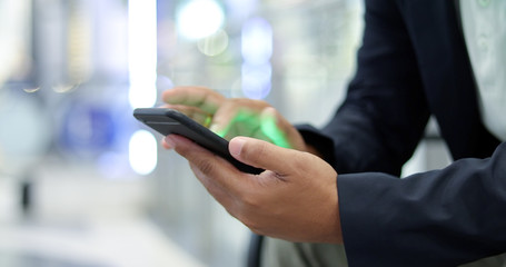 Businessman asian using phone for celling and texting on her mobile phone