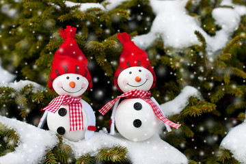 Winter, Christmas holiday background - Happy snowman friends in drifts