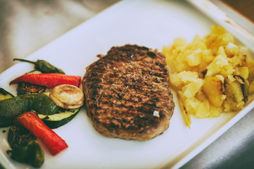 Angus beef meat with potatoes and vegetables