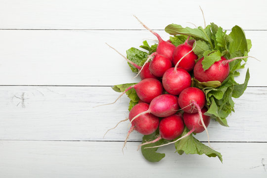 Exotic red radish, red and white vegetable food. Copy space for text.