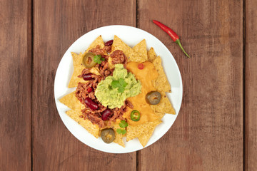 Nachos with cheese and chilli, traditional Mexican snack, with copyspace
