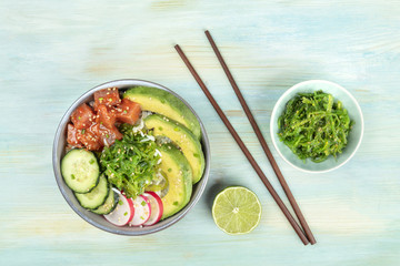Hawaiian tuna poke salad with wakame and copy space
