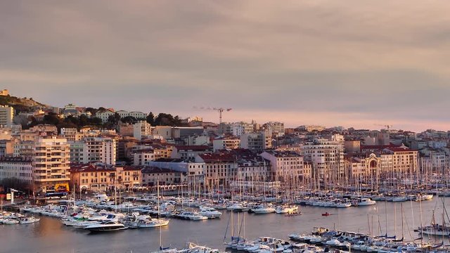 marseille old port city center timelapse at sunset zoom out aerial view
