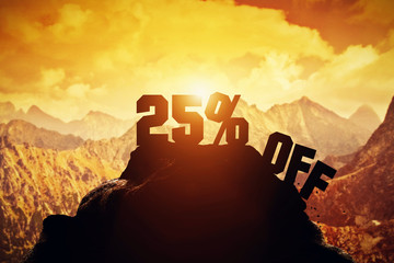 25% off writing on a mountain peak.