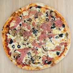 Pizza delicious classic style on wooden table background. Fresh food variety, closeup top view promotional photo. Italian traditional culture