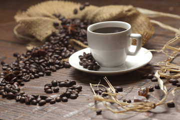 White cup of coffee with beans