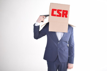 The businessman is holding a box with the inscription:CSR