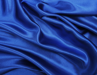Smooth elegant blue silk or satin luxury cloth texture as abstract background. Luxurious background design