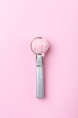 Tasty strawberry ice cream on vintage metal spoon