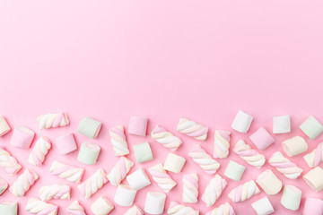 Marshmallows on tender pink background