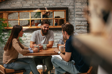 Fototapeta premium Friends enjoying a coffee together