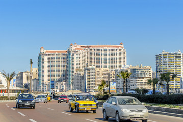 Fototapeta na wymiar Alexandria, Egypt, 21 February 2018: Buildings and cars