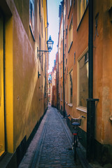 Fototapeta na wymiar Narrow street in Old Town in Stockholm, Sweden