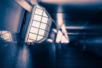 Lanterns in a dark tunnel, toned photo