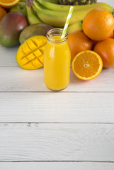 Tropical Fruit Smoothy on a White Wood Table
