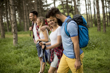 Group of young people are hiking in mountain