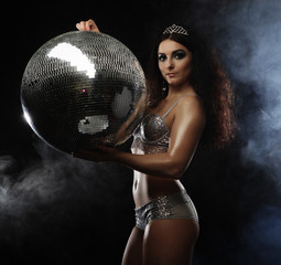 dancer brunette girl wearing lingerie with disco ball