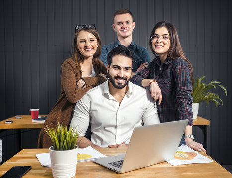 Team of office workers at workplace in modern office