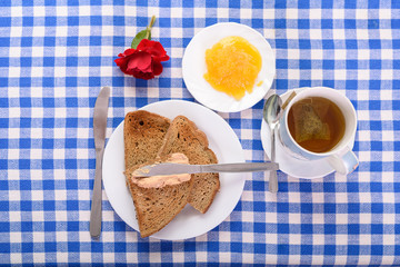 a cup of tea, a piece of toast with honey for breakfast