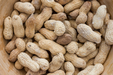 Close up view of groundnuts in a bowl. Selective focus.