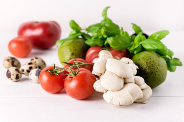 Healthy Diet Food on White Background Vegetables Tomatoes Peppers Green leaves Mushrooms Eggs Diet Food Concept Ingredients for Salad
