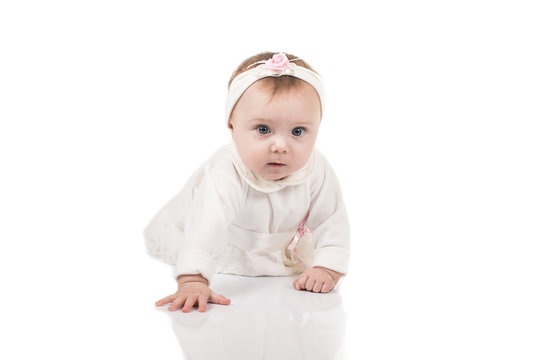 Infant child baby girl toddler crawling happy looking straight isolated on a white background