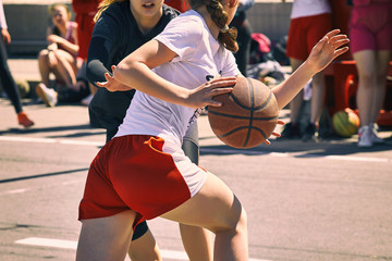 Naklejka premium Women play basketball.