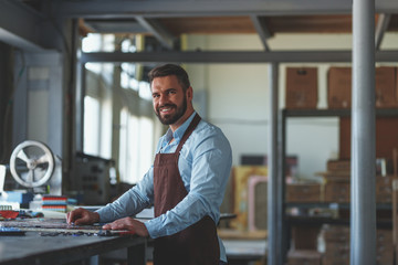 Smiling man in workshop