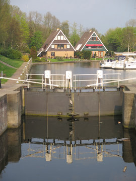 Canalside houses and closed lock gates