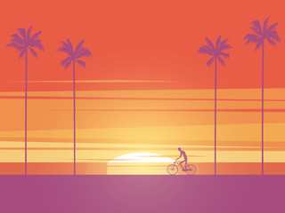 Obraz premium Biker riding bicycle at sunrise or sunset on the beach with palm trees in background. Symbol of active, healthy, sport lifestyle.
