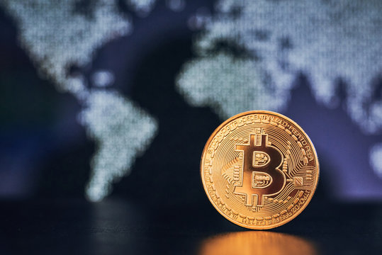 Bitcoin on world map background
