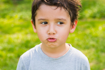 dark-haired boy in a forest