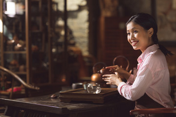 Young asian girl at tea ceremony