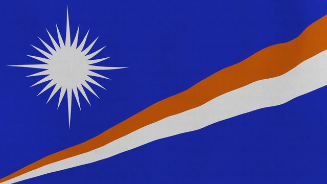 Loopable: Flag of Marshall Islands...Marshallese official flag gently waving in the wind. Highly detailed fabric texture for 4K resolution. 15 seconds loop.