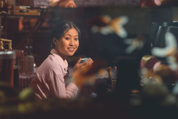 Smiling asian girl at a tea ceremony