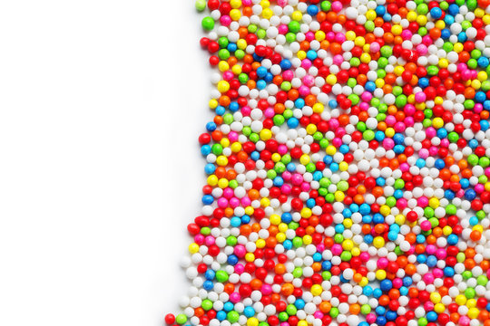 close up of colorful sprinkle sugar with white background