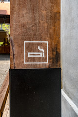 Smoking area sign on wood board