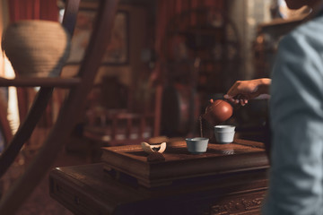 Young girl pouring tea