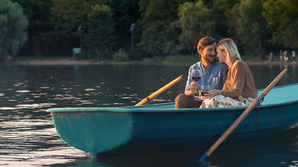 Smiling young couple in a boat