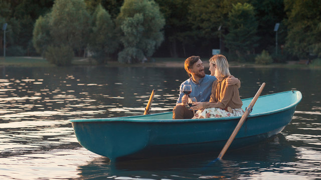 Happy young couple in a boat