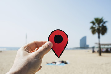 man with a red marker in La Barceloneta beach