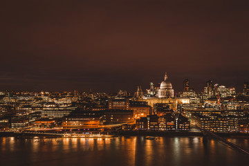 Fototapeta premium London aerial view of modern city skyline at night on River Thames