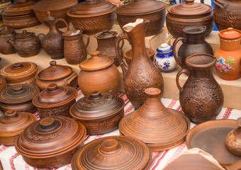 Fototapeta na wymiar Counter with clay pots close-up