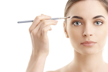 Fototapeta premium Woman applying makeup