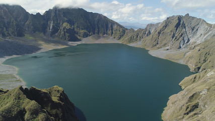 Naklejka na ściany i meble Crater lake of the volcano Pinatubo among the mountains, Philippines, Luzon. Aerial view beautiful landscape at Pinatubo mountain crater lake. Travel concept